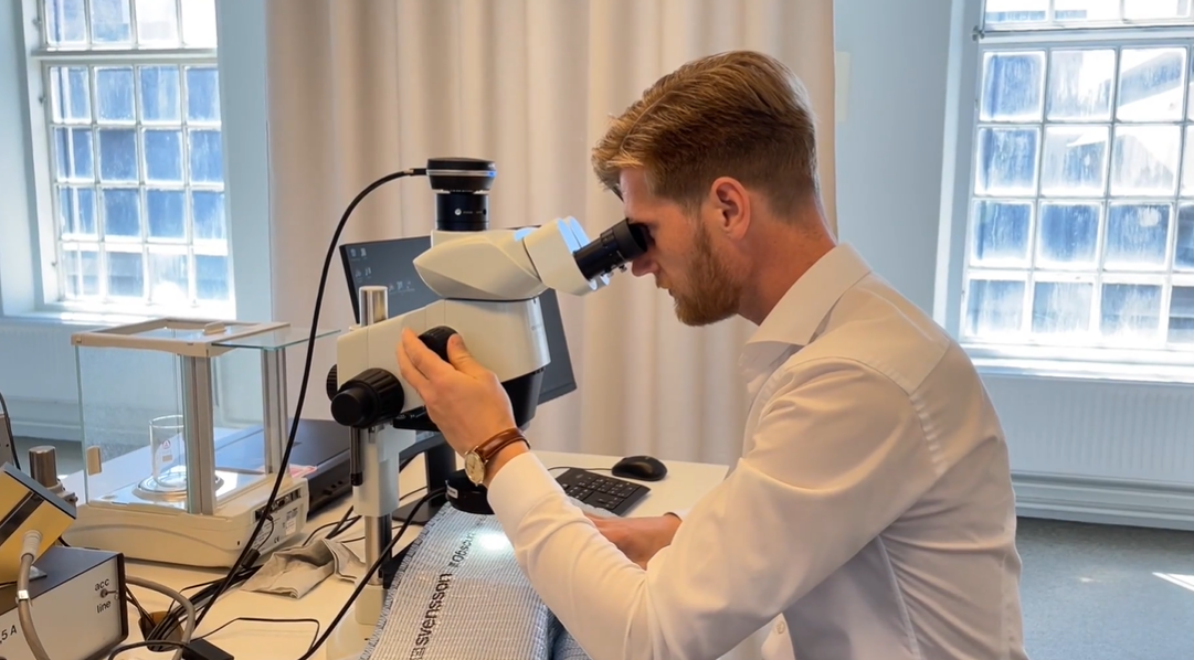 Niclas enjoys the microscope work